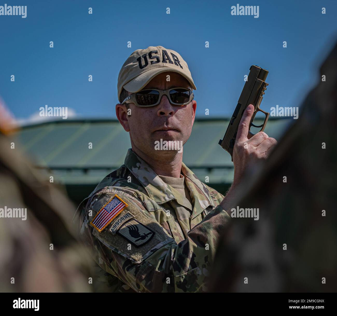 Army Reserve 1st Sgt. Chris Volmer demonstrates the proper handling on