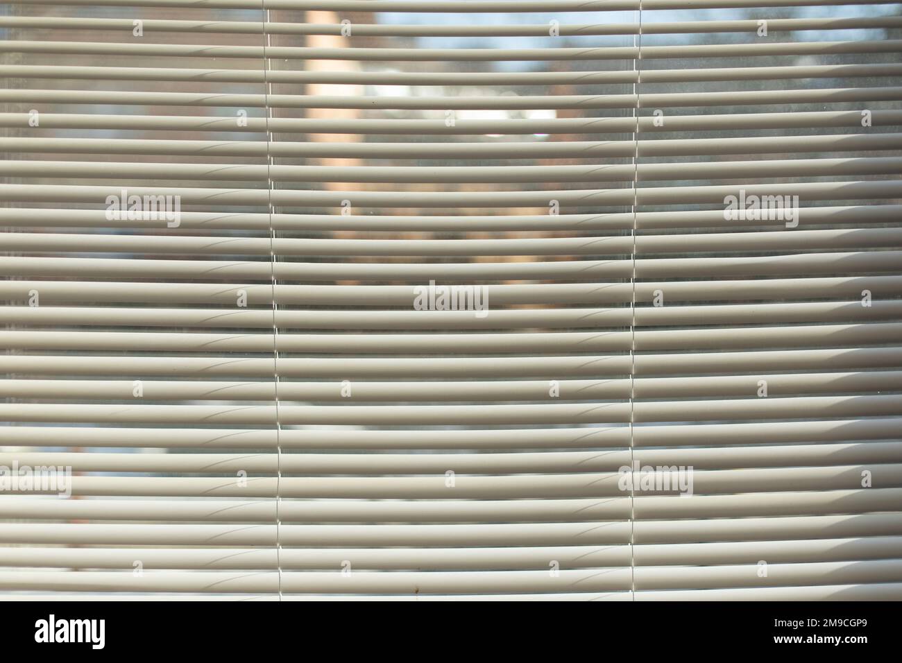 Blinds on window. White blinds. Interior details. Stock Photo