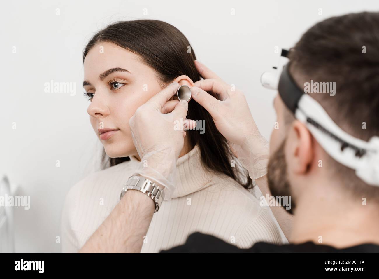 Consultation with otolaryngologist. Treatment of woman ear pain
