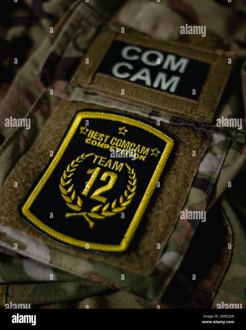 The competitor patch for the 2022 Spc. Hilda I. Clayton Best Combat Camera Competition is displayed at Fort A.P Hill, Virginia, May 17, 2022. The annual multi-day competition tests the tactical and technical proficiency of visual information and public affairs specialists across the DOD and participating international competitors. Stock Photo