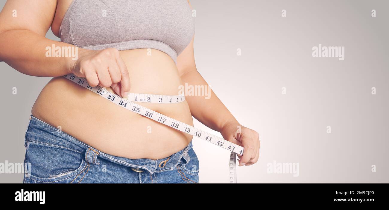 https://c8.alamy.com/comp/2M9CJP0/fat-woman-holding-a-measurement-tapebody-fat-percentage-with-measuring-tape-for-fat-2M9CJP0.jpg