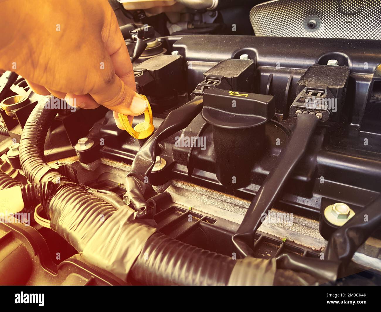 Car Engine oil mechanic working in auto repair service.engine oil check