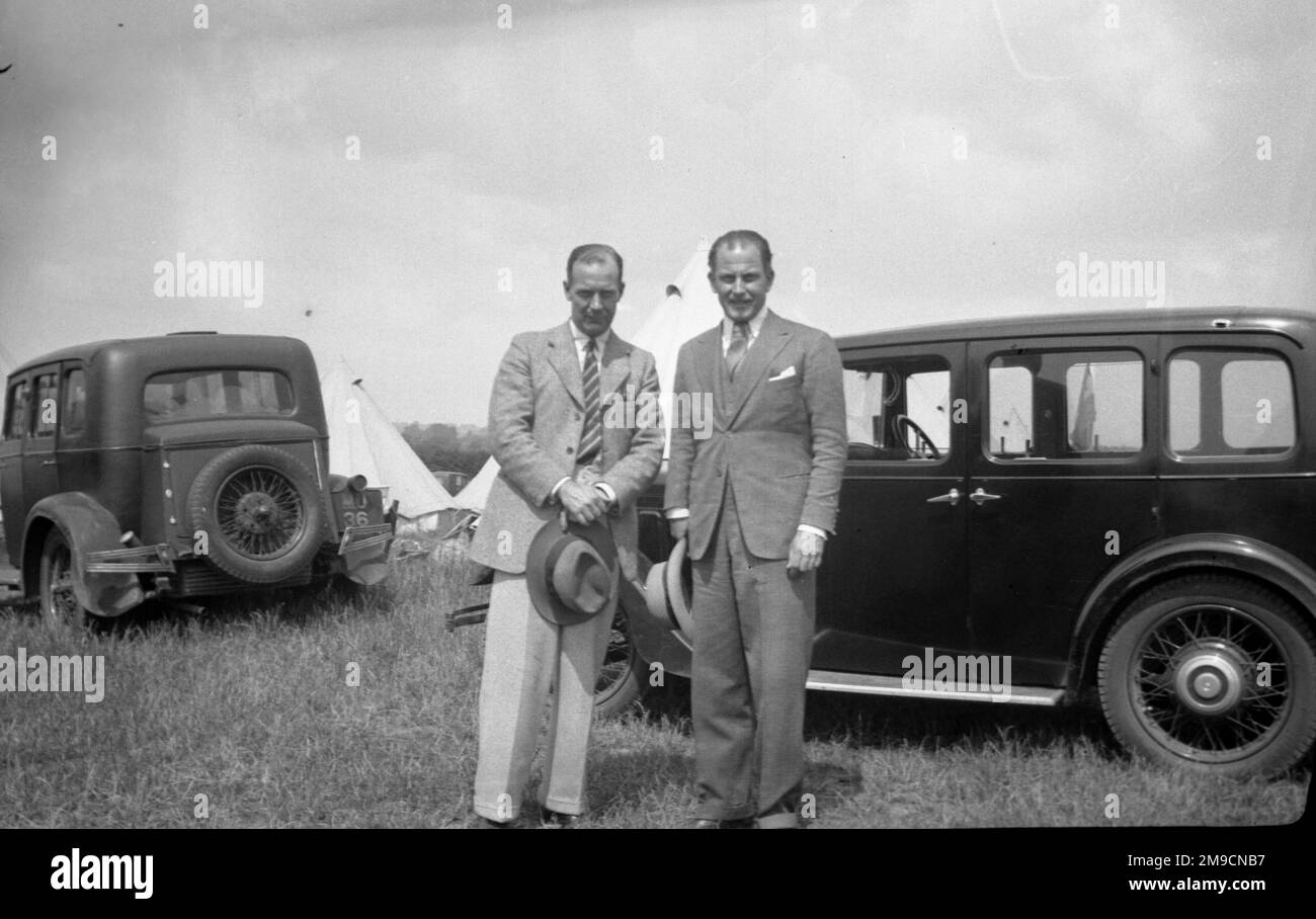 Two gentlemen stand next to their cars in Yorkshire Stock Photo
