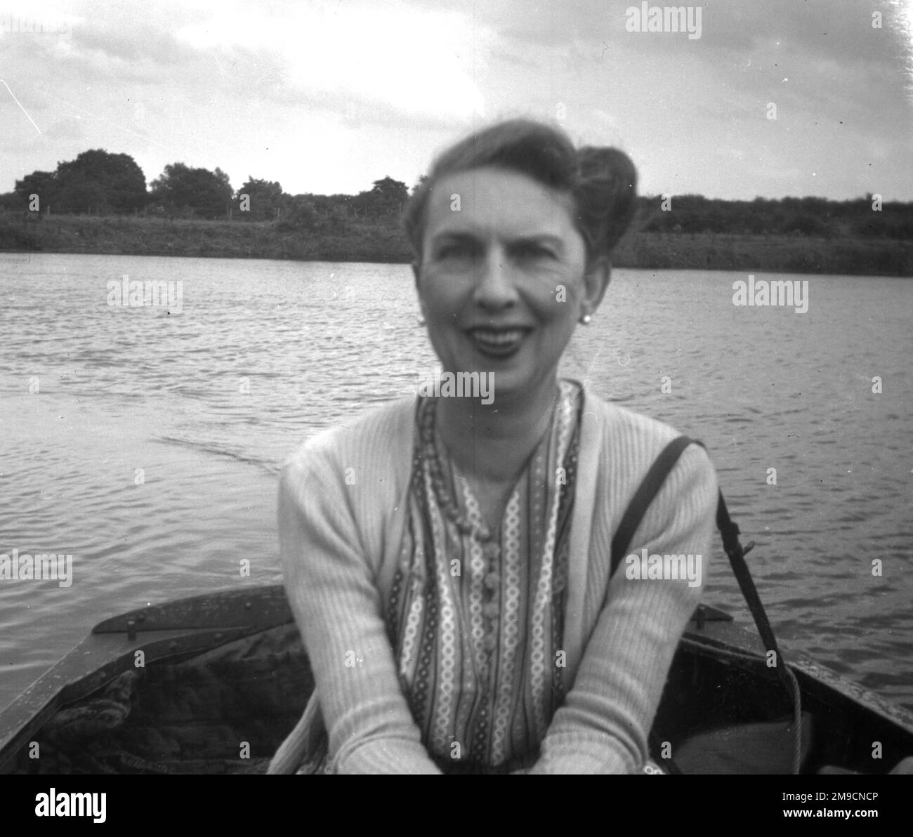 Woman in a rowing boat Black and White Stock Photos & Images - Alamy