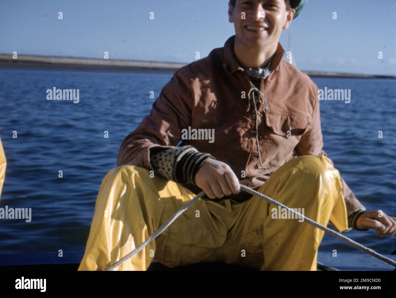 Man in yellow oilskins hires stock photography and images Alamy
