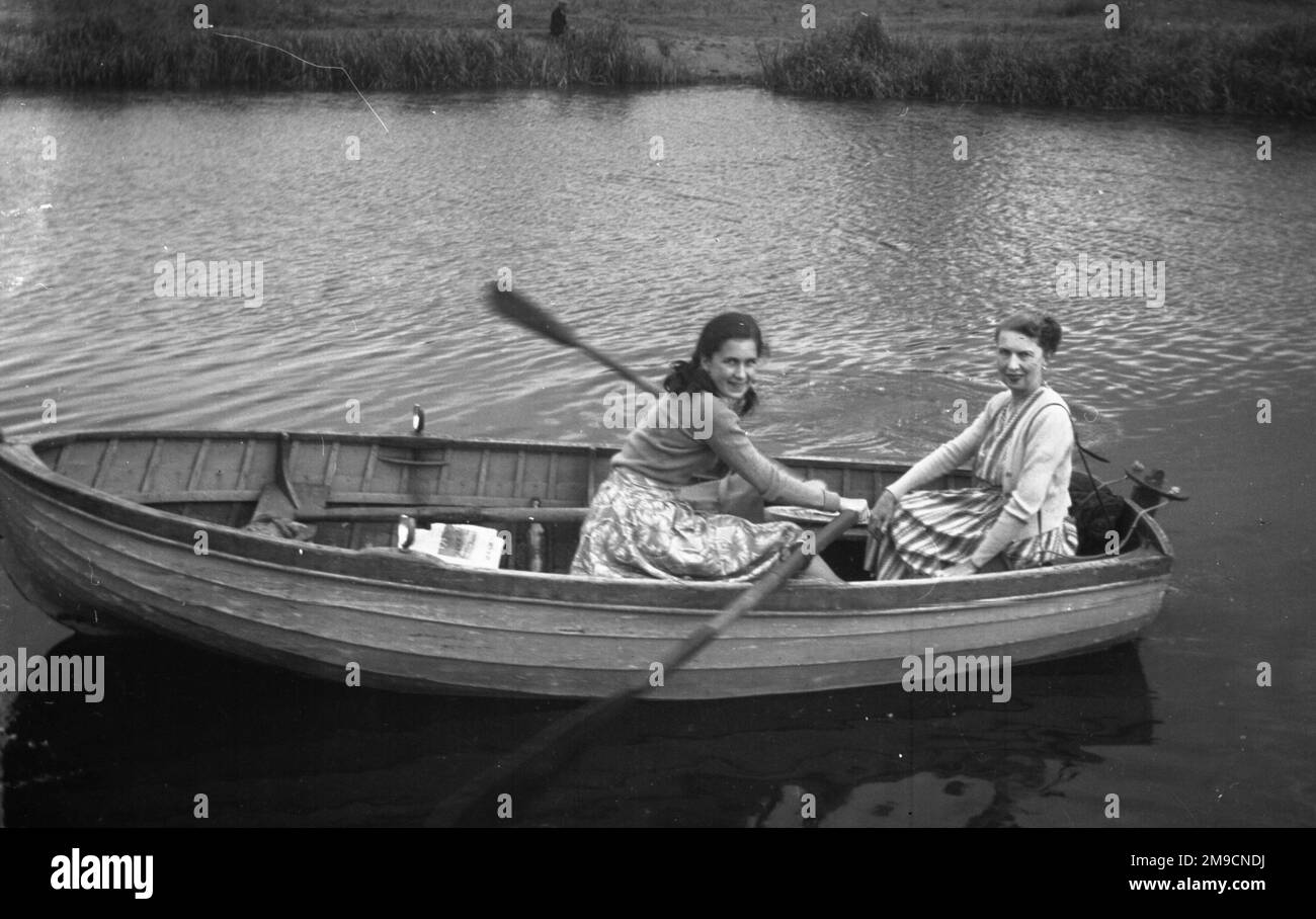 Two girls boat Black and White Stock Photos & Images - Alamy