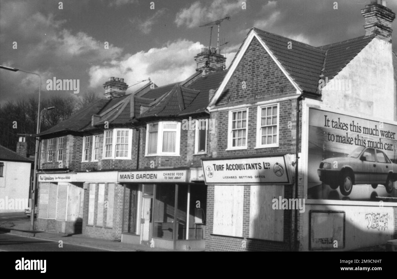 Whyteleafe High Street, Surrey with boarded-up houses and shops. Stock Photo