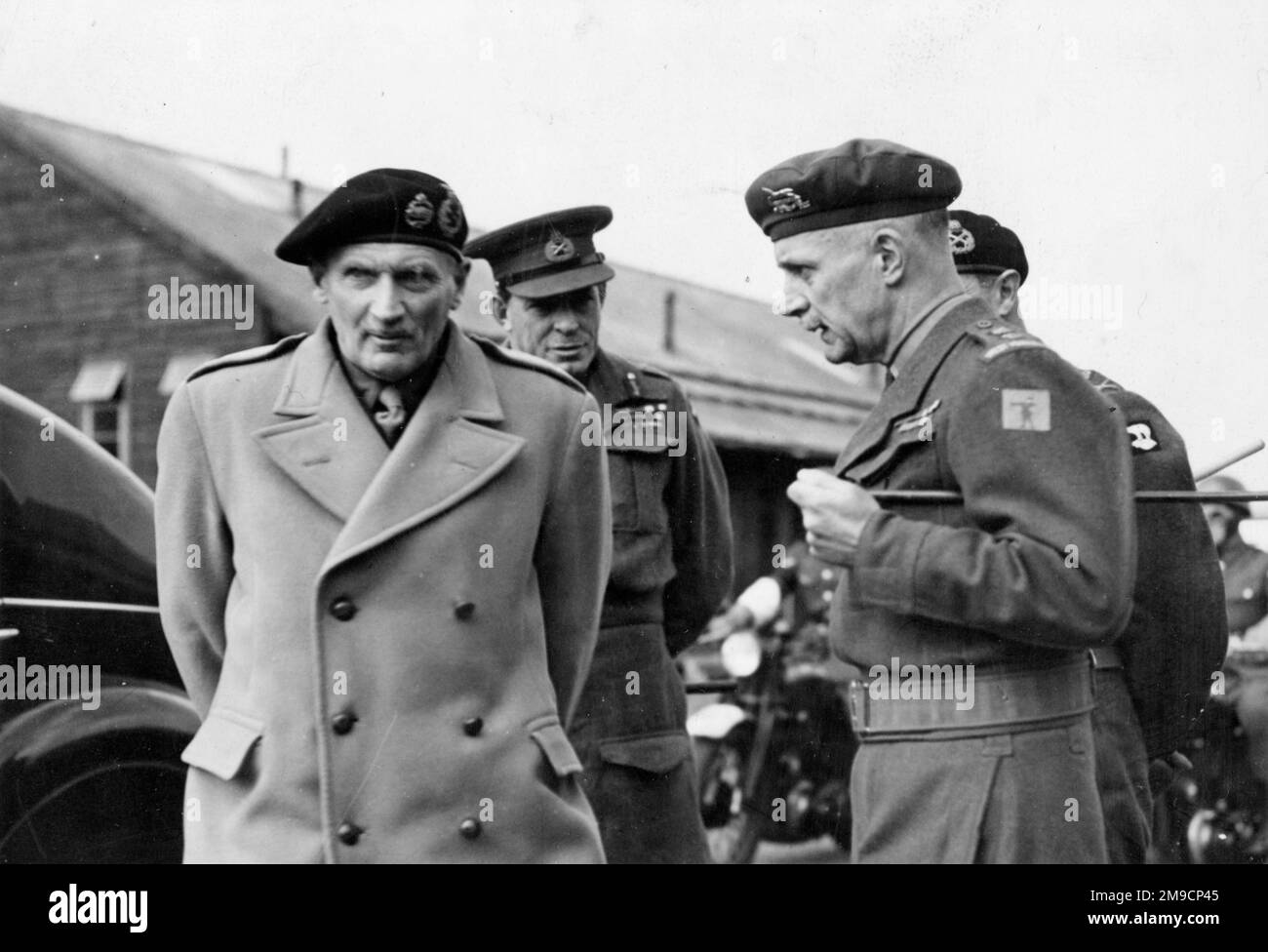 Field Marshal Bernard Law Montgomery, 1st Viscount Montgomery of Alamein (1887-1976), General Richards, and two other officers, probably during an inspection visit to an army camp. Stock Photo