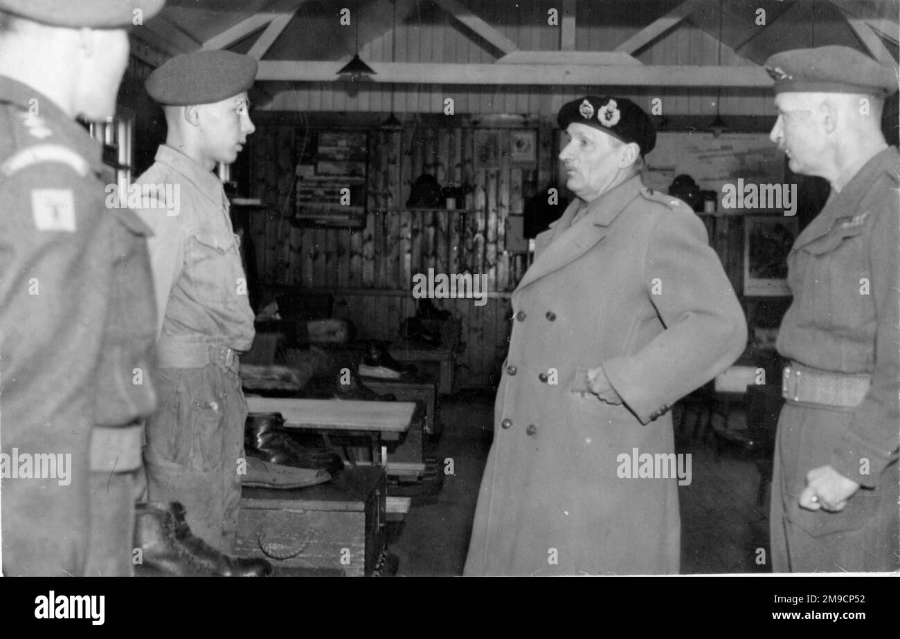 Field Marshal Bernard Law Montgomery, 1st Viscount Montgomery of Alamein (1887-1976), inspecting cadets in a hut at a training camp in Yorkshire with Colonel George Innes at his side. Stock Photo