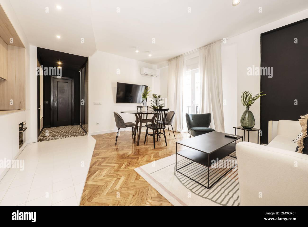 Loft With Glass Round Black Dining Table With Vase And Open Plan Loft with glass round black dining table with vase and open plan