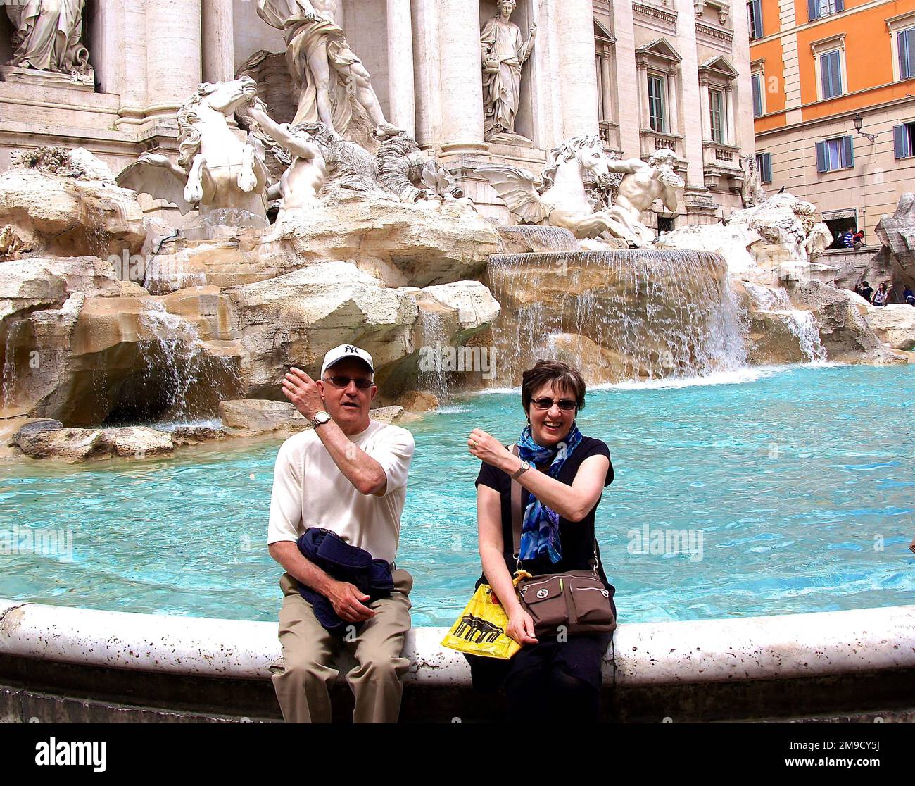 Tossing coins in Trevi Fountain Stock Photo Alamy Tossing coins in Trevi Fountain Stock Photo Alamy