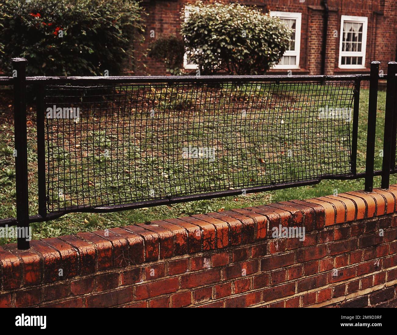 Railings made from WWI stretchers surrounding a block of flats, Peckham