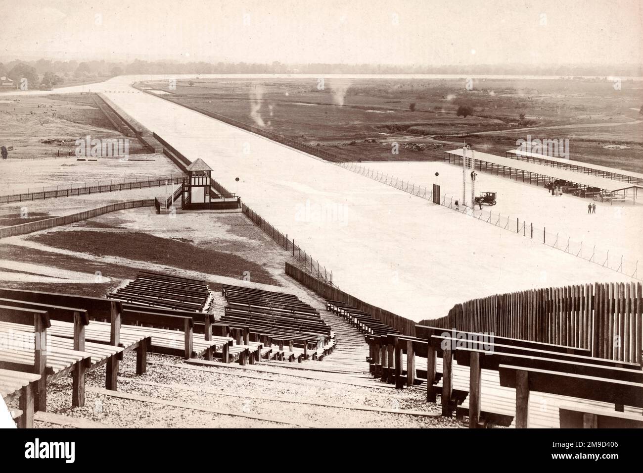 View of winning post from grandstand with bays in background. Stock Photo