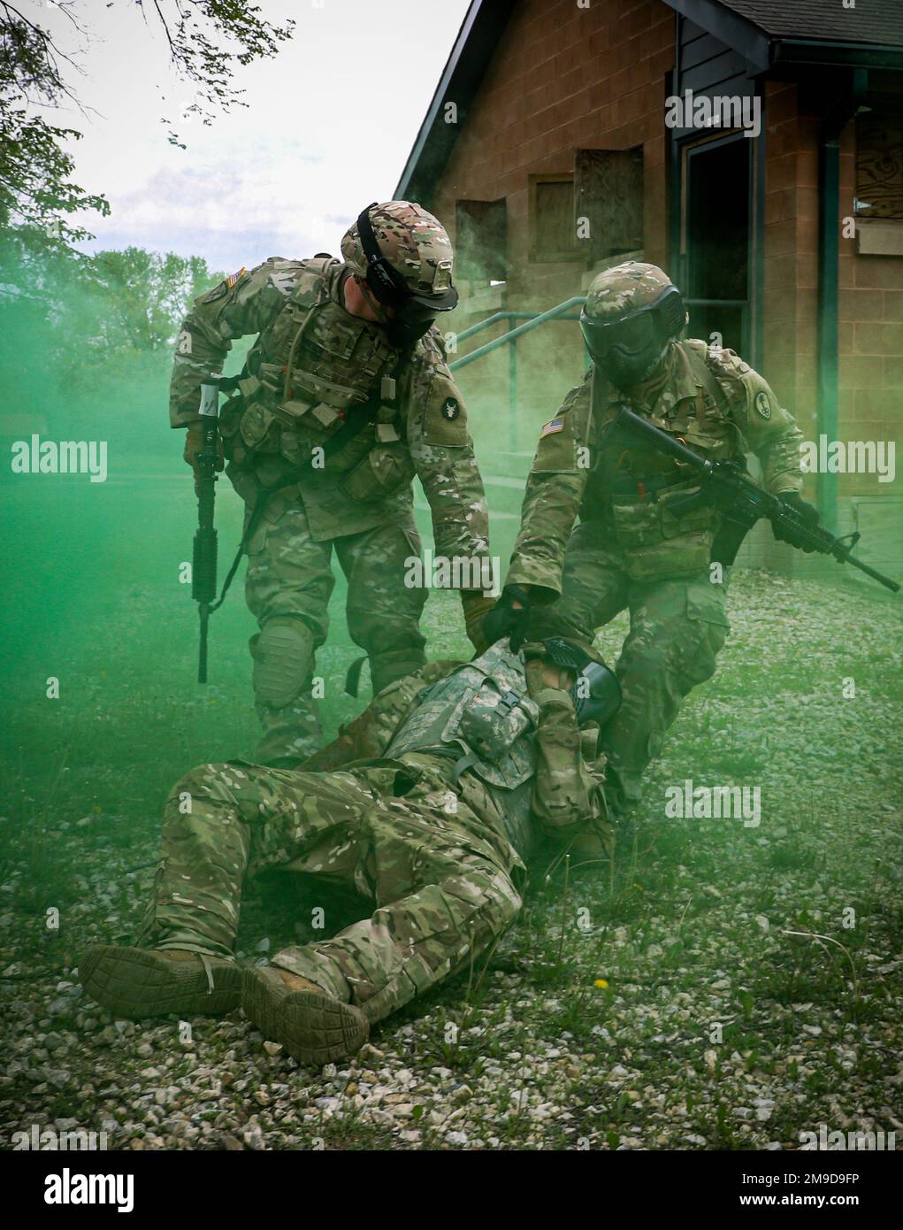 Soldiers in the U.S. National Guard and Reserves drag an injured Soldier to  a notional casualty collection point during a field training exercise in  the Camp Dodge training area while attending a