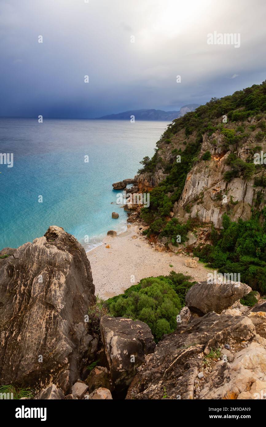 Sandy Beach on a rocky coast near Cala Gonone, Sardinia. Stock Photo