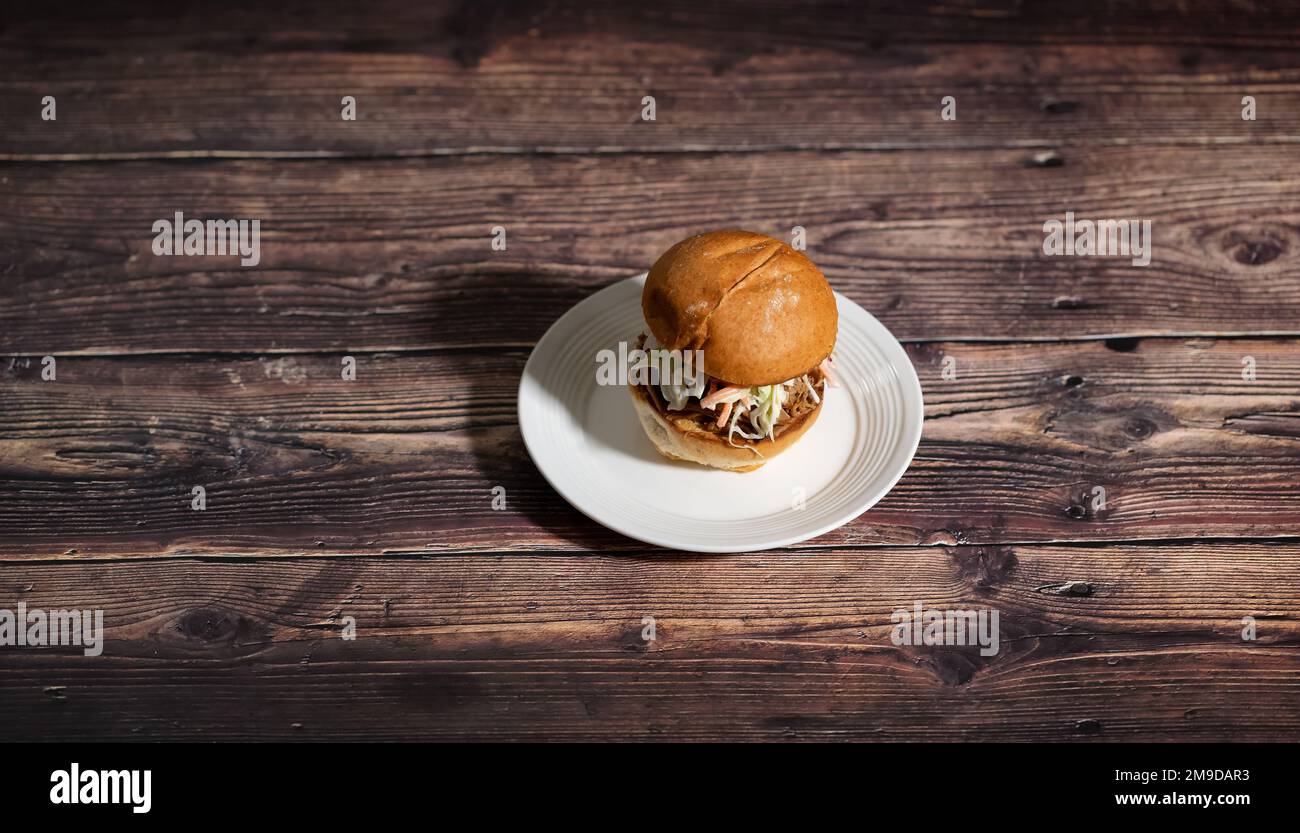 Pulled Pork Sandwish with Coleslaw on a plate Stock Photo