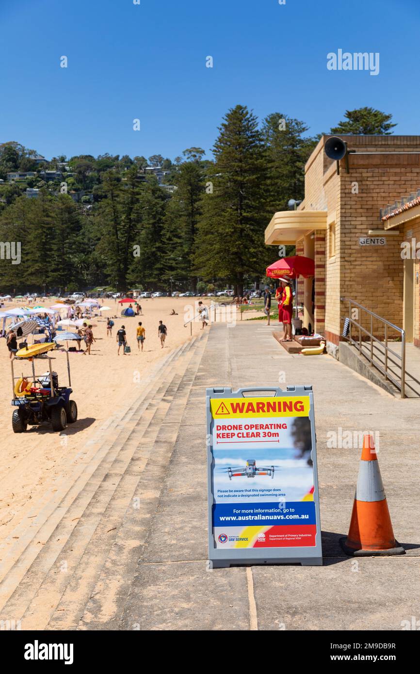 Palm Beach Sydney Australia surf rescue volunteers flying aerial UAV drones to spot and identify sharks in the ocean, warning signs advice, Sydney Stock Photo