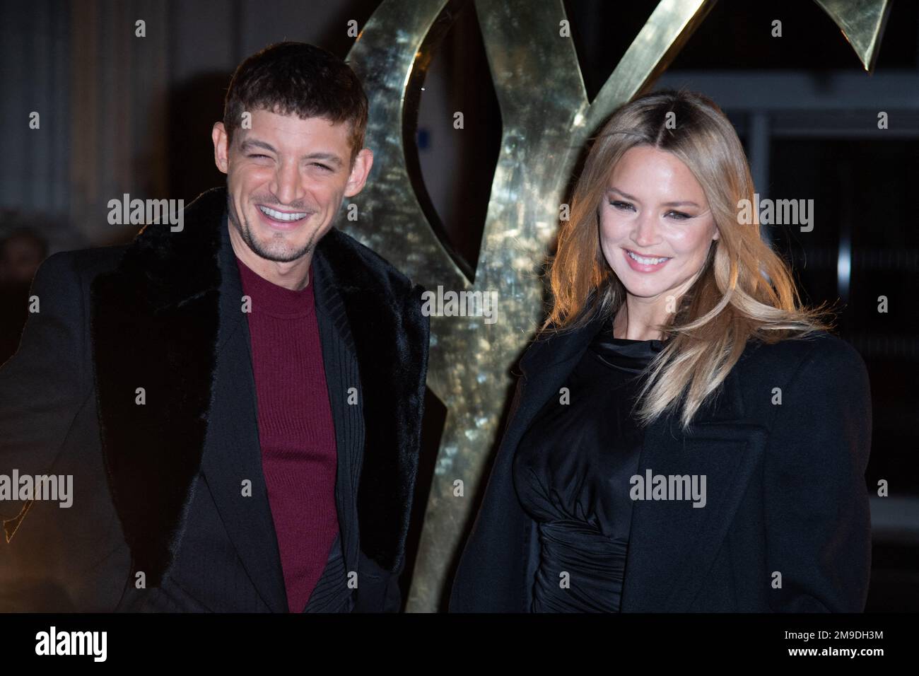 Neils Schneider and Virginie Efira attending the Saint Laurent Menswear
