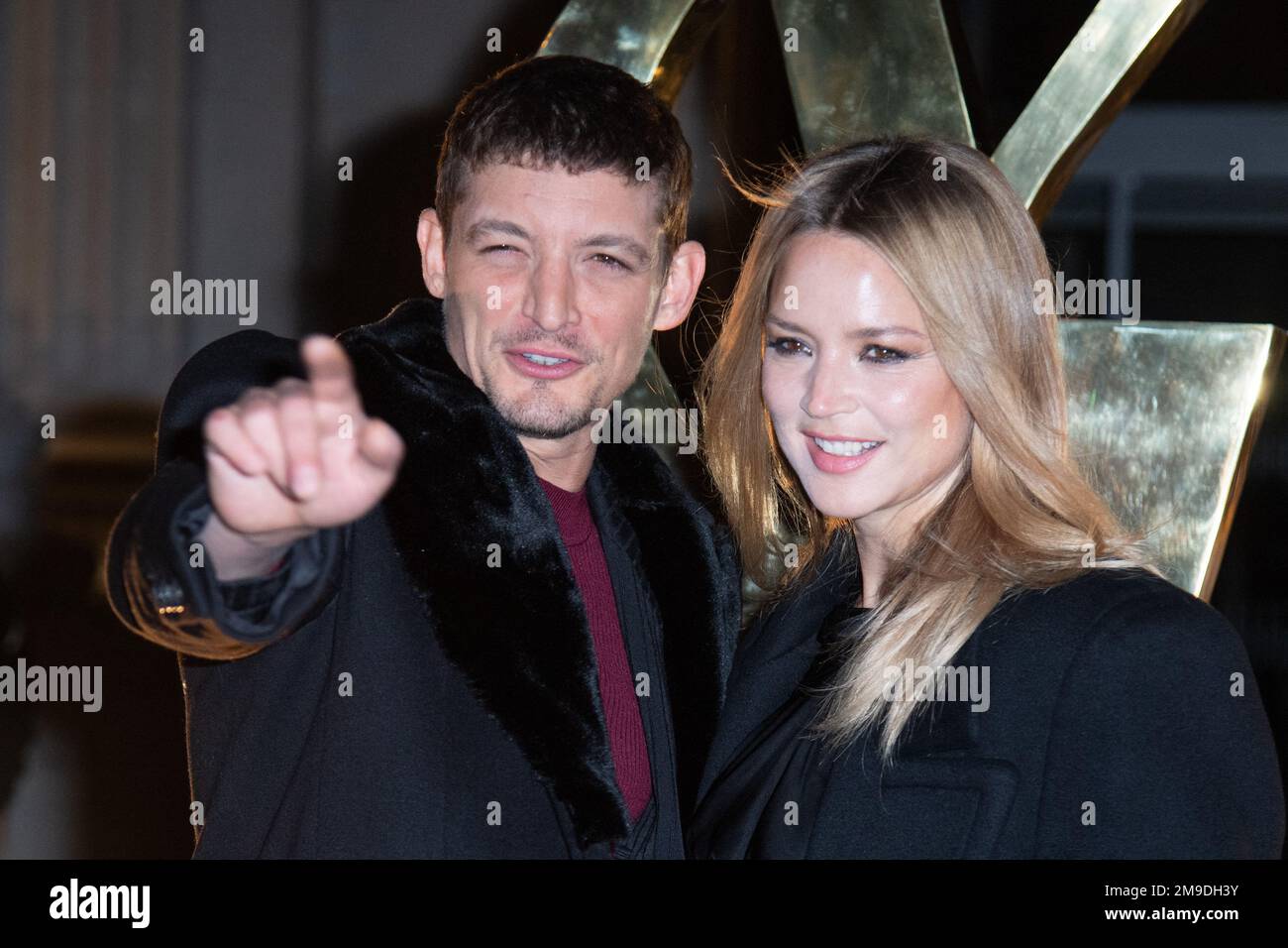 Neils Schneider and Virginie Efira attending the Saint Laurent Menswear