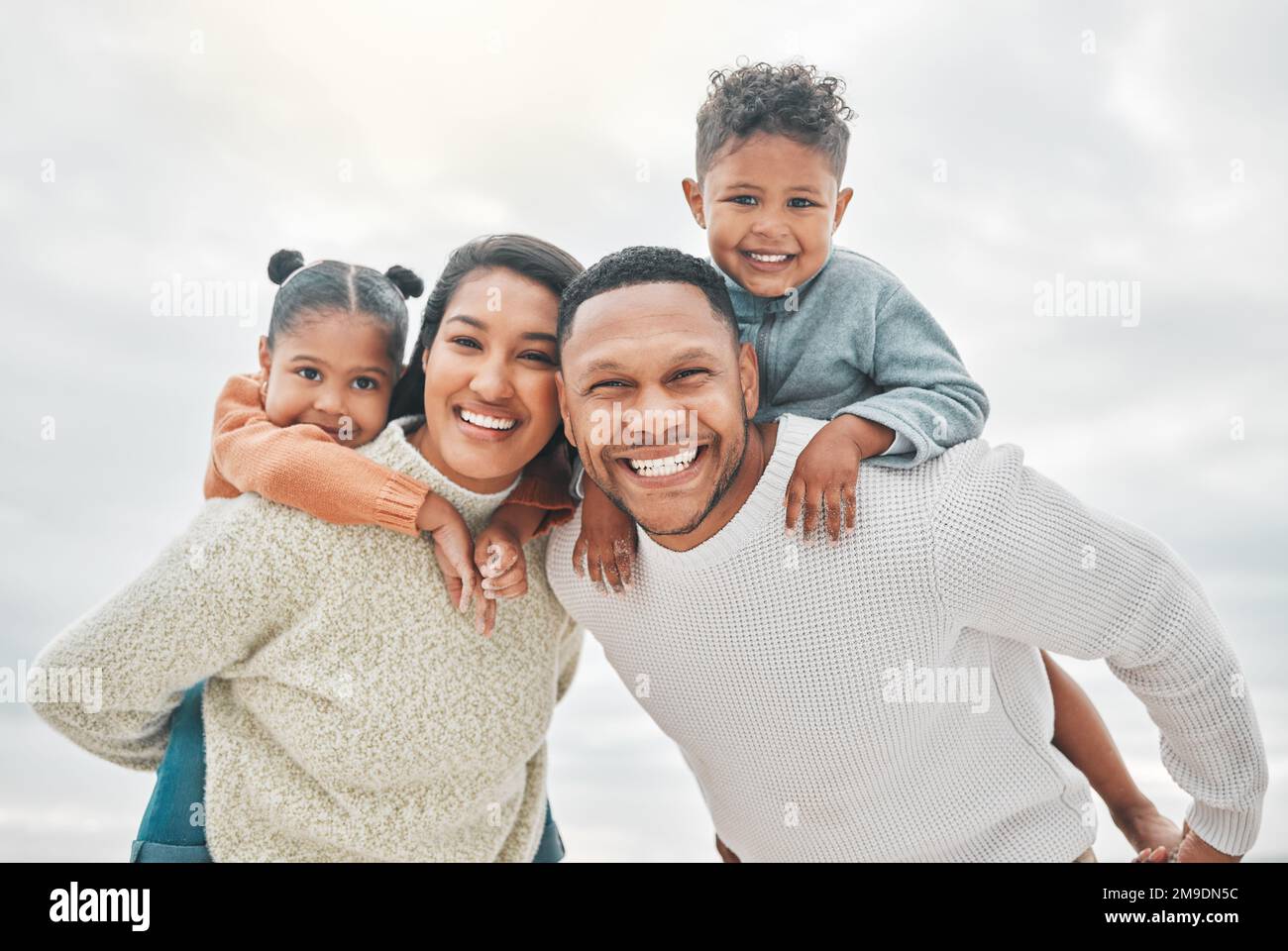 Name a better family outing. an affectionate family of four on the