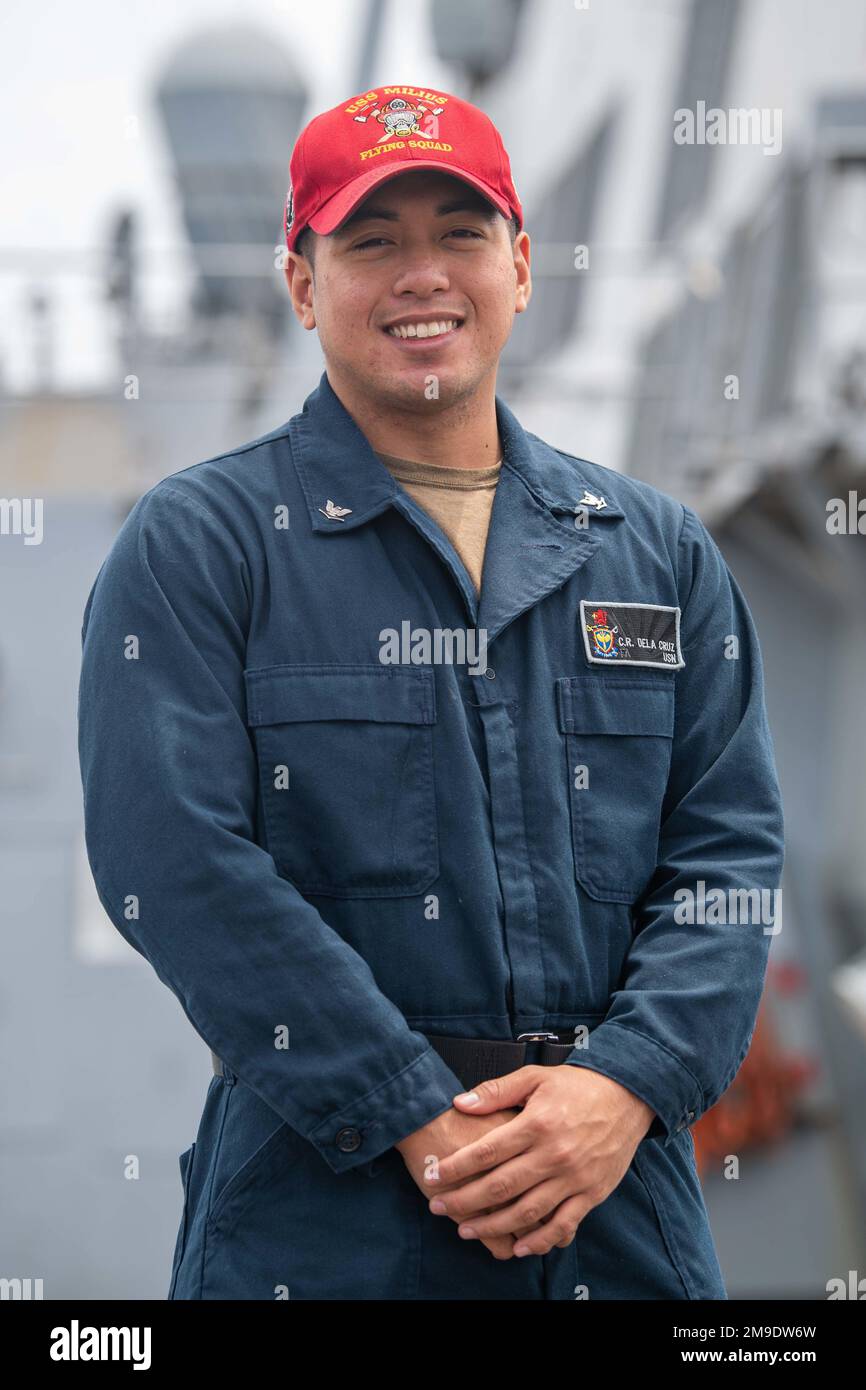 PACIFIC OCEAN (May 18, 2022) Personnel Specialist 3rd Class Carl Jefferson Dela Cruz, from Glendale, Calif., poses for a photograph aboard the Arleigh Burke-class guided missile destroyer USS Milius (DDG 69). USS Milius is assigned to Task Force 71/Destroyer Squadron (DESRON) 15, the Navy’s largest forward-deployed DESRON and the U.S. 7th fleet’s principal surface force. Milius is on a scheduled deployment in the U.S. 7th Fleet area of operations to enhance interoperability through alliances and partnerships while serving as a ready-response force in support of a free and open Indo-Pacific reg Stock Photo
