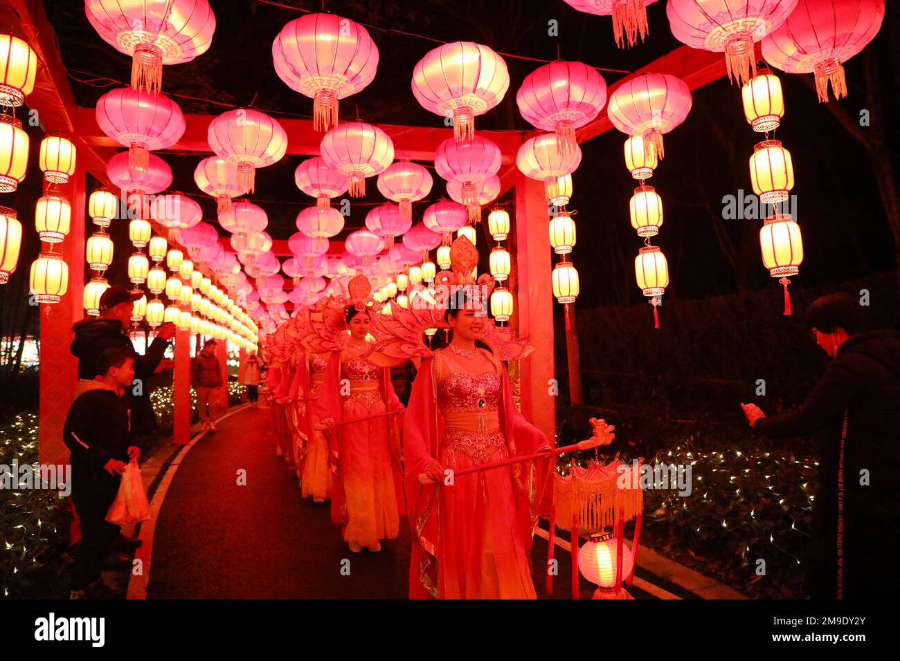 CHONGQING, CHINA - JANUARY 17, 2023 - Young women hold lanterns during the Tang Dynasty parade in Chongqing, China, on the evening of January 17, 2023 Stock Photo