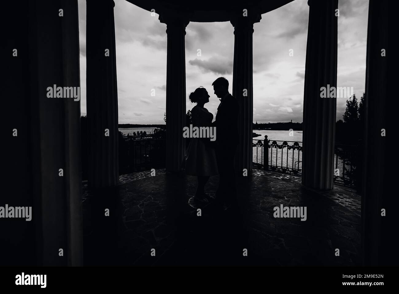 black and white silhouette of a couple in love. The bride and groom ...