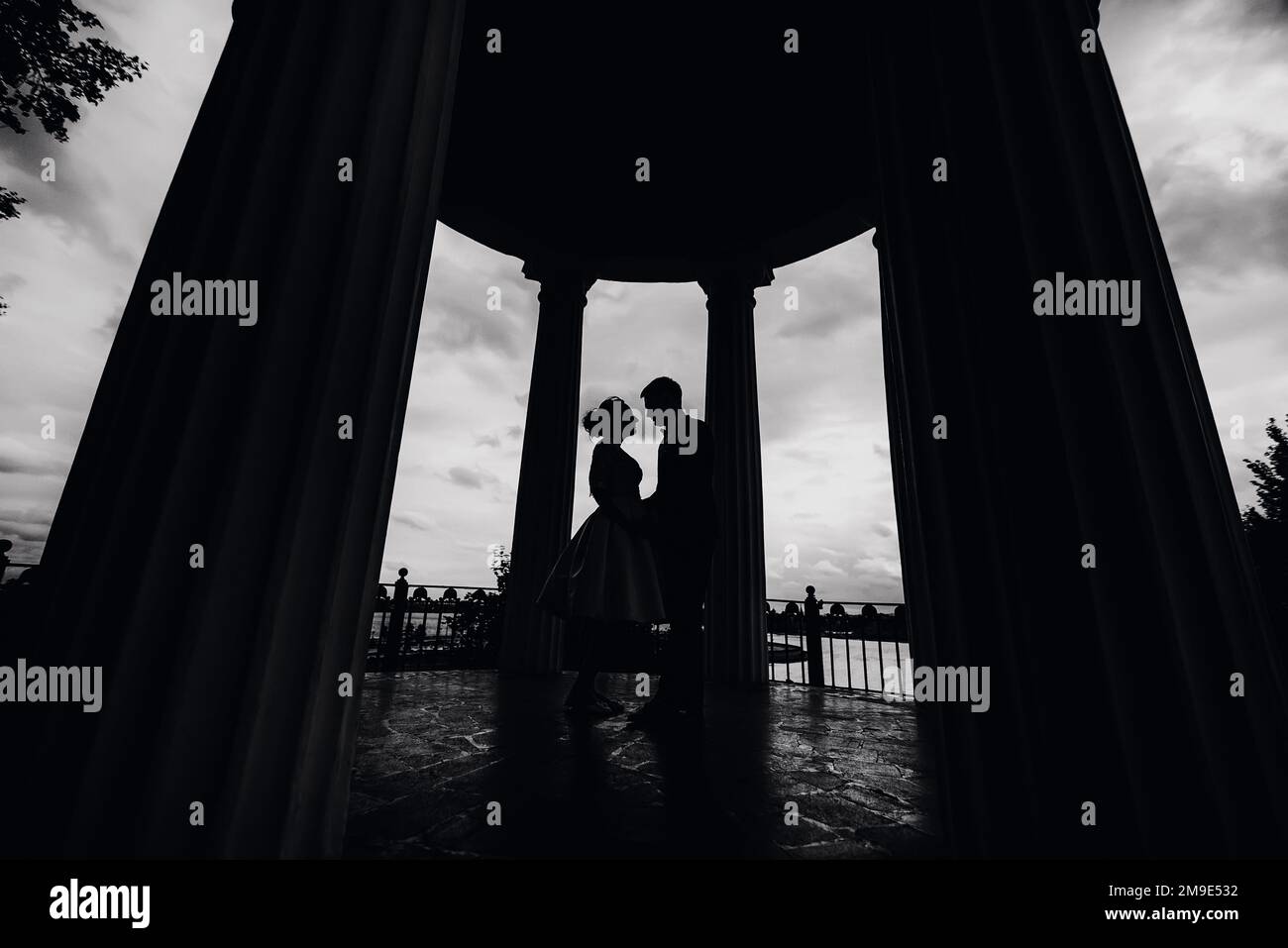 black and white silhouette of a couple in love bride and groom holding ...