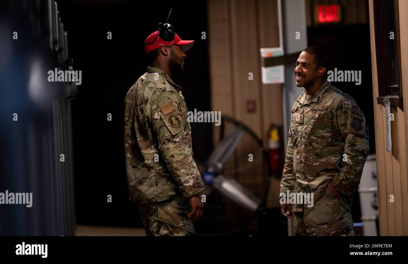 From left: U.S. Air Force Senior Airman Jaonte Horden, 375th Security Forces Squadron combat arms instructor, and Master Sgt. John Ortiz, 375th Security Forces first sergeant share a laugh in the Combat Arms Training and Maintenance shooting range on Scott Air Force Base, Illinois, May 18, 2022. This light hearted moment was prior to a shooting competition between members of Team Scott and first responders from the local community during Police Week, a presidential proclamation brought into effect by President John F. Kennedy in 1962 honoring the contributions of law enforcement officers who l Stock Photo