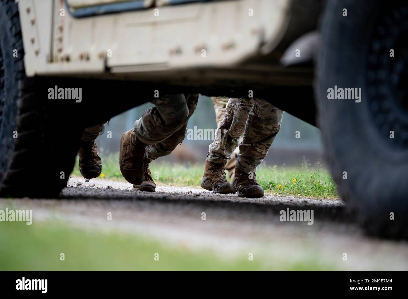 Airmen from the 375th Air Mobility Wing push a Humvee during a section ...