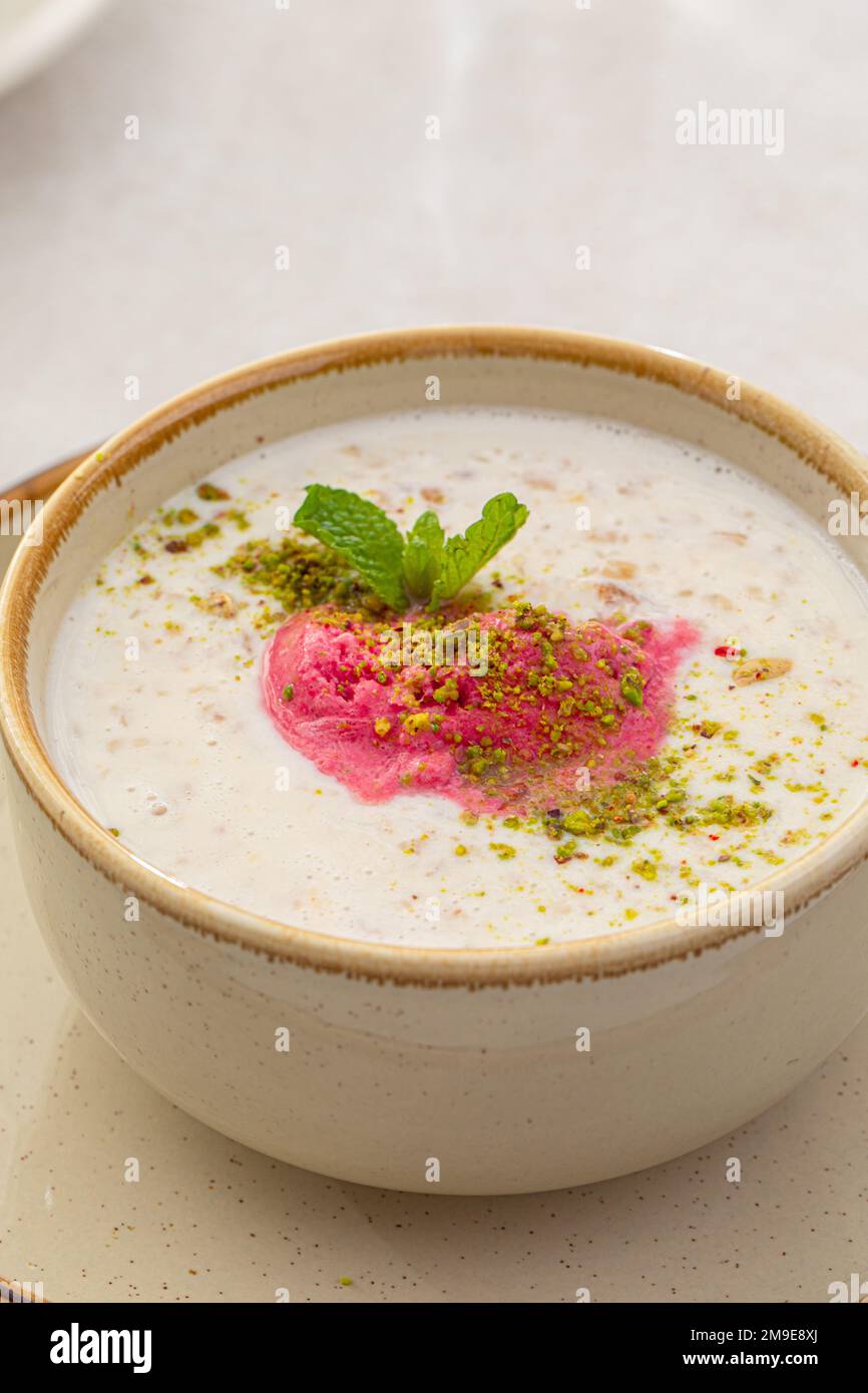 Mixed cereal porridge with berry sorbet Stock Photo