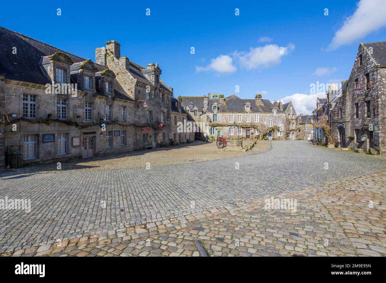 village-square-with-old-horse-drawn-cart-and-fountain-locronan-named