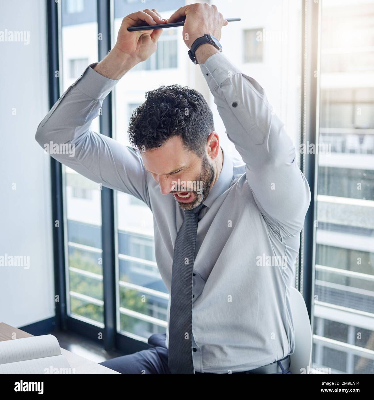 Why is nothing working today a young businessman smashing his laptop