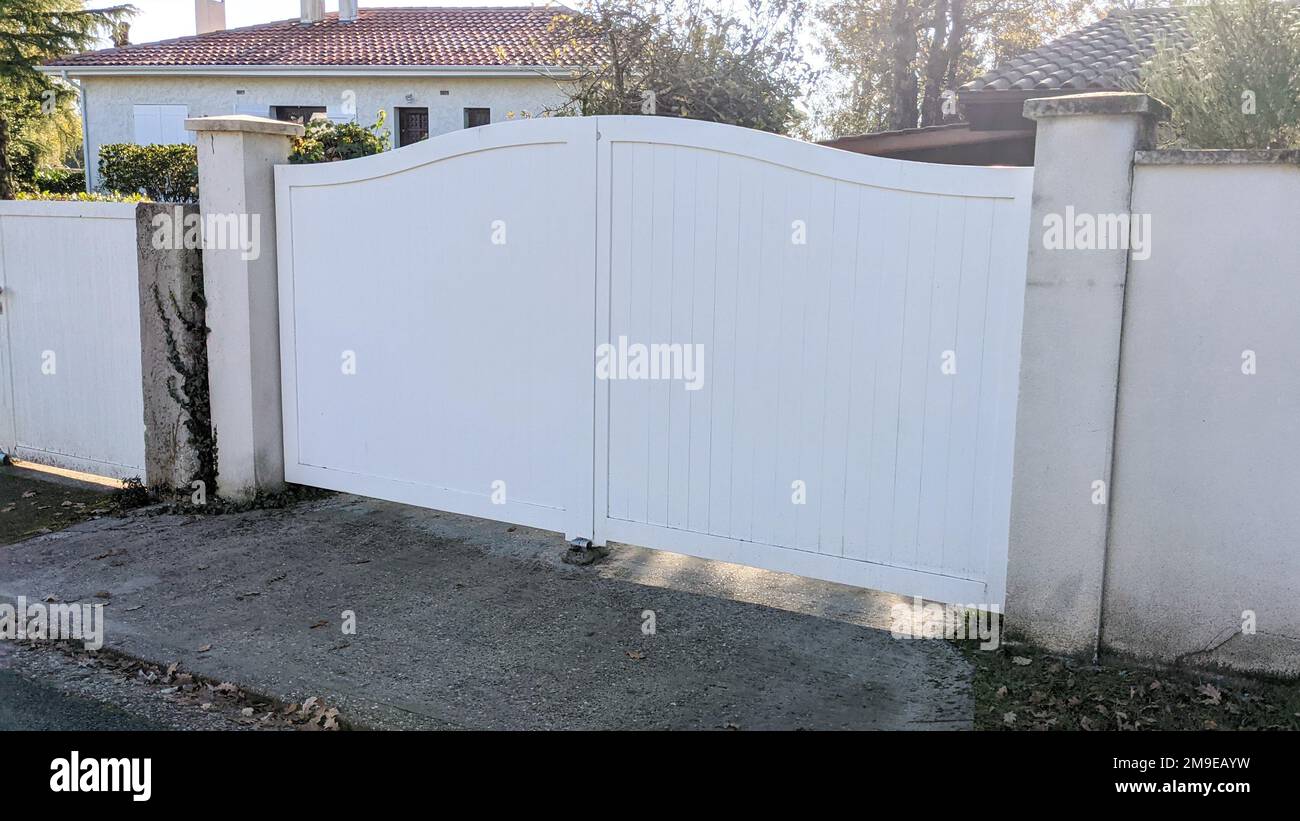 modern steel white gate aluminum portal with blades of suburbs house Stock Photo
