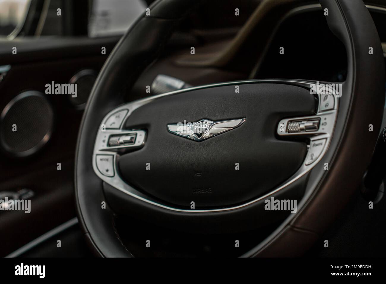 MOSCOW, RUSSIA DECEMBER 04, 2021 Genesis GV80 (JX1) steering wheel close up view. Genesis logo