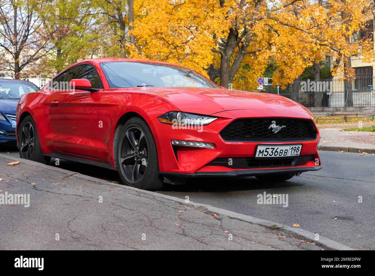 St-Petersburg, Russia - October 7, 2021: Sixth generation Ford Mustang GT, red sporty coupe car stands parked on the street Stock Photo