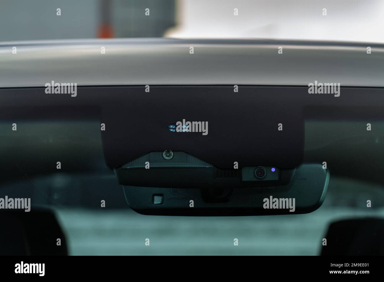 Rain and light sensor on the windshield of the car. Modern car safety