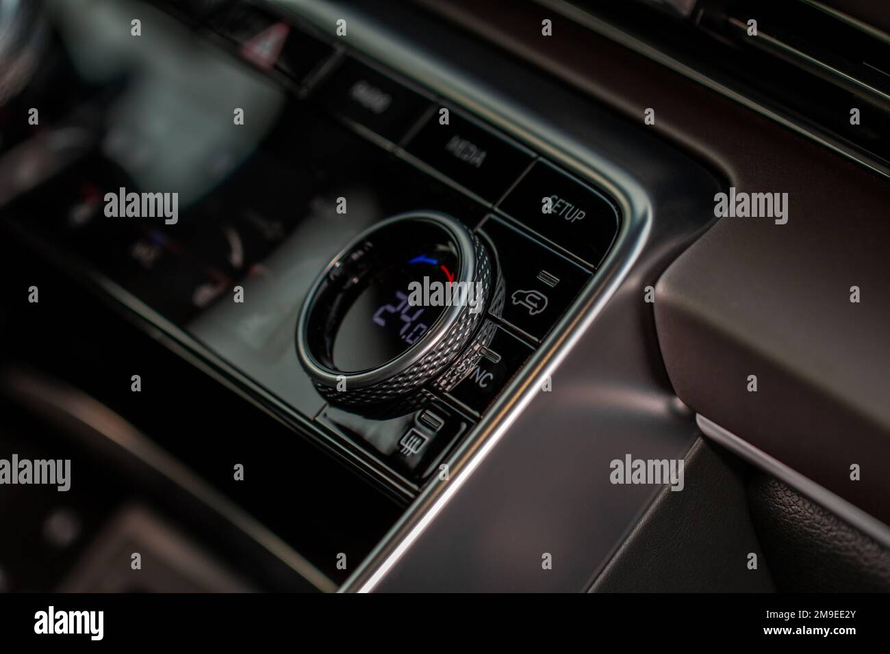 Modern car passenger’s temperature control. Car air conditioning system button. Automatic