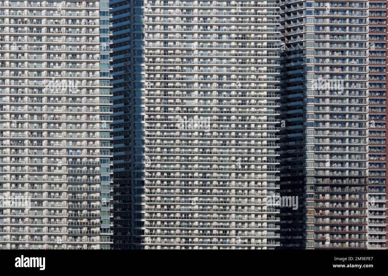 Dense urban living in a row of skyscrapers in Tokyo, Japan Stock Photo