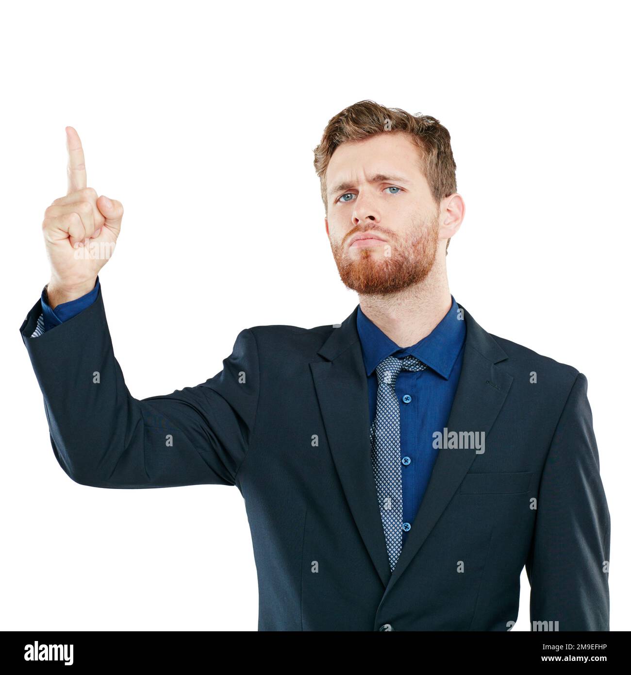 Portrait, pointing and marketing with a business man looking serious in studio isolated on a white background. Mindset, point and advertising with a Stock Photo