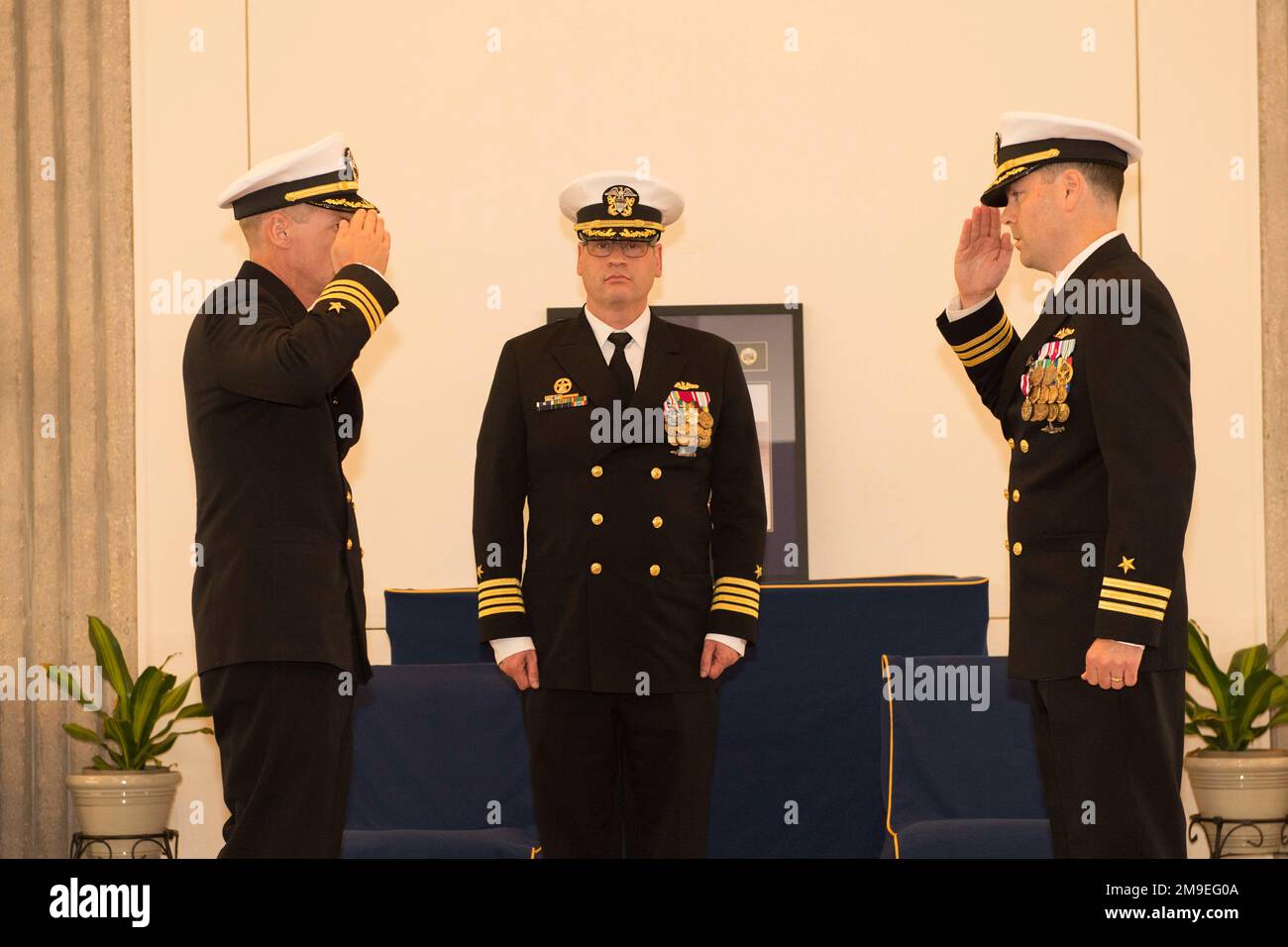 KINGS BAY, Ga. (May 19, 2022) Cmdr. Steven Dykstra (left), incoming commanding officer of the Ohio-class ballistic-missile submarine USS Wyoming (SSBN 742) (Blue), salutes Cmdr. Ben Pollock (right), outgoing commanding officer, relieving him of his duties during a change of command ceremony held at the chapel onboard Naval Submarine Base Kings Bay, Georgia. U.S. Navy photo by Chief Mass Communication Specialist Ashley Berumen (Released) Stock Photo