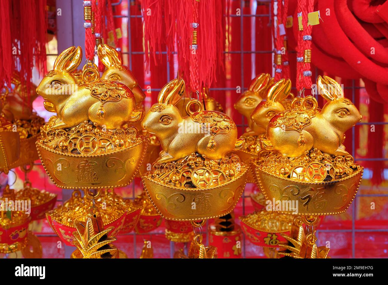 Golden Rabbit trinkets embossed with auspicious Chinese characters to