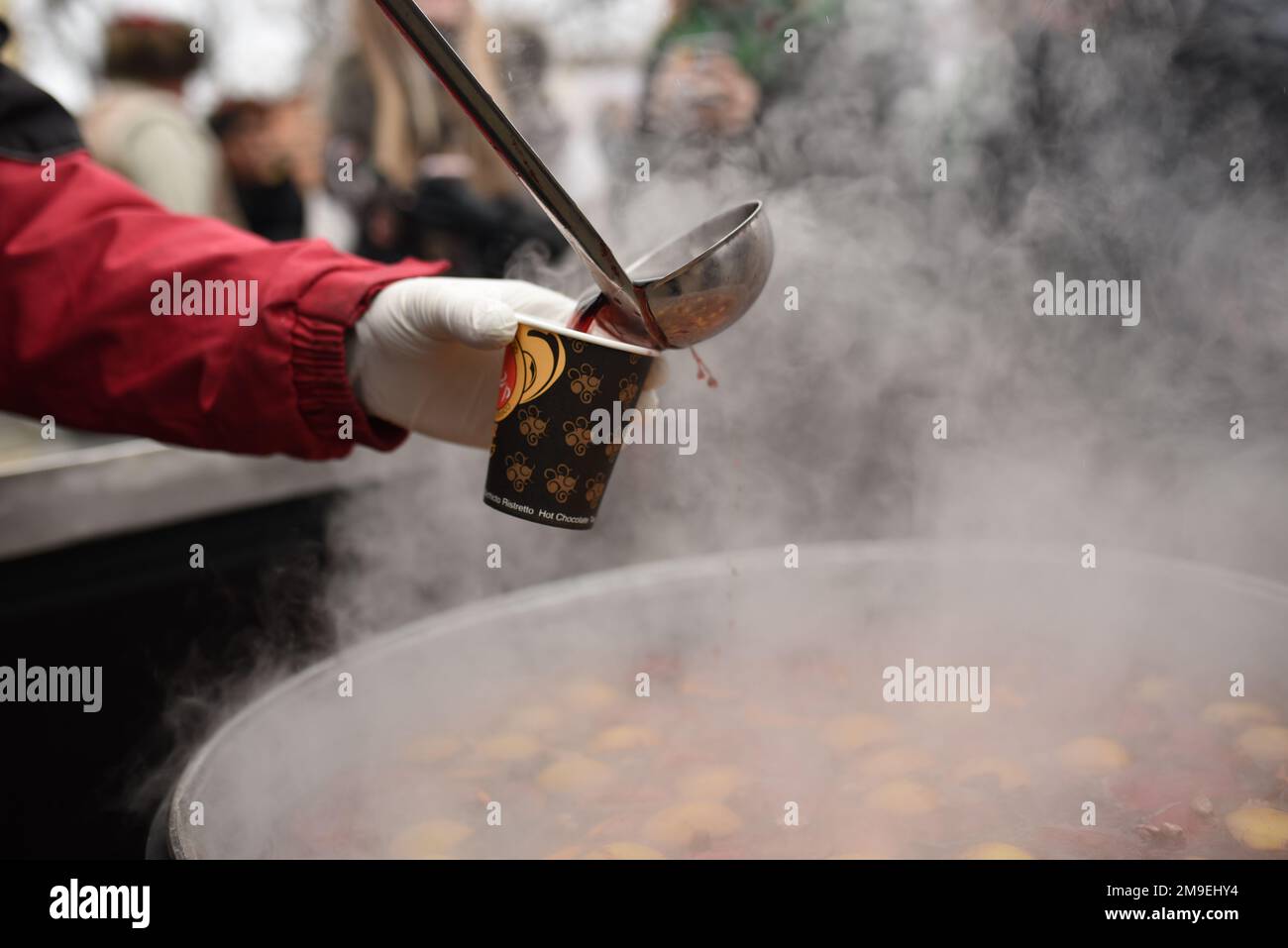 Cooking in a large pot, outside Stock Photo - Alamy