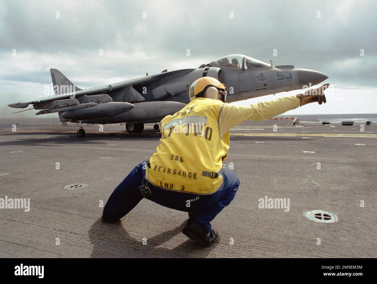 Aviation Boatswain's Mate Third Class Adrian Tellez launches the second