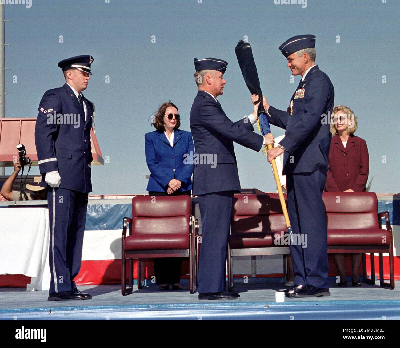 US Air Force Lieutenant General John B. Sams Center foreground Commander of the 15th Air Force at Travis Air Force Base California presents Brigadier General Steven A. Roser with his retired one