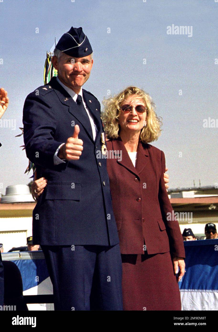 Former 60th Air Mobility Wing Commander at Travis Air Force Base, California, Brigadier General Steven A. Roser, retires from the United States Air Force after 29 years of dedicated service. With his wife, Linda, at his side he gives a thumbs up to Travis Team co-workers, friends and civic leaders. Base: Travis Air Force Base State: California (CA) Country: United States Of America (USA) Stock Photo