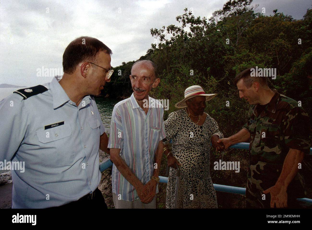 In one of their final trips to the Brisas del Mar (Sea Breezes) retirement home, US Air Force Lieutenant Colonel, chaplain Bruce Arnold and US Air Force SENIOR MASTER Sergeant Jim McKenzie spent the afternoon with Carlos Moreno and Migdalea Murillo. This photograph is part of the November 1999 AIRMAN Magazine article 'Adios Amigos'. Base: Panama Canal Country: Panama (PAN) Stock Photo