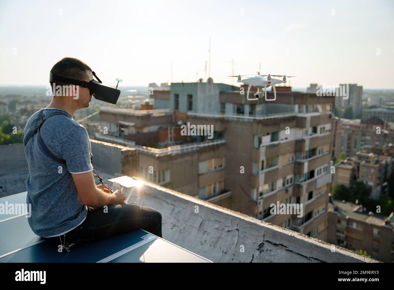 Man with drone flying at the city Stock Photo