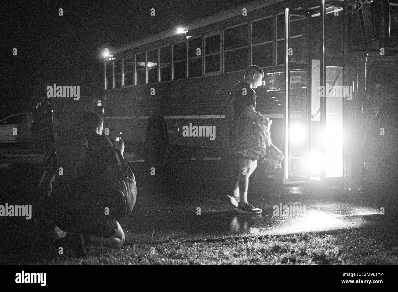 Service members load a bus before competing in the 2022 Spc. Hilda I. Clayton Best Combat Camera Competition at Fort A.P Hill, Virginia, May 17, 2022. The annual multi-day competition tests the tactical and technical proficiency of visual information and public affairs specialists across the DOD and participating international competitors. Stock Photo