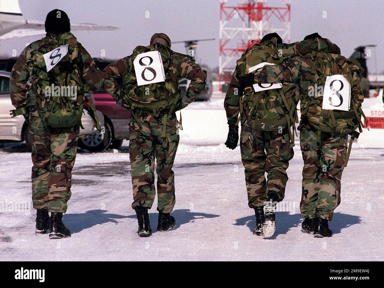 Medium shot. Members of 436th Security Forces Squadron cross the finish line in the Security Forces ruck march honoring Korean War Veterans at Dover AFB, Delaware on January 22, 2000. Medium shot.  Members of 436th Security Forces Squadron cross the finish line in the Security Forces ruck march honoring Korean War Veterans at Dover AFB, Delaware on January 22, 2000. Stock Photo